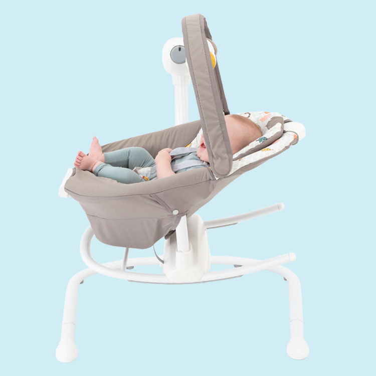 Baby sitting in Graco Duet Sway multi-direction seat on blue background