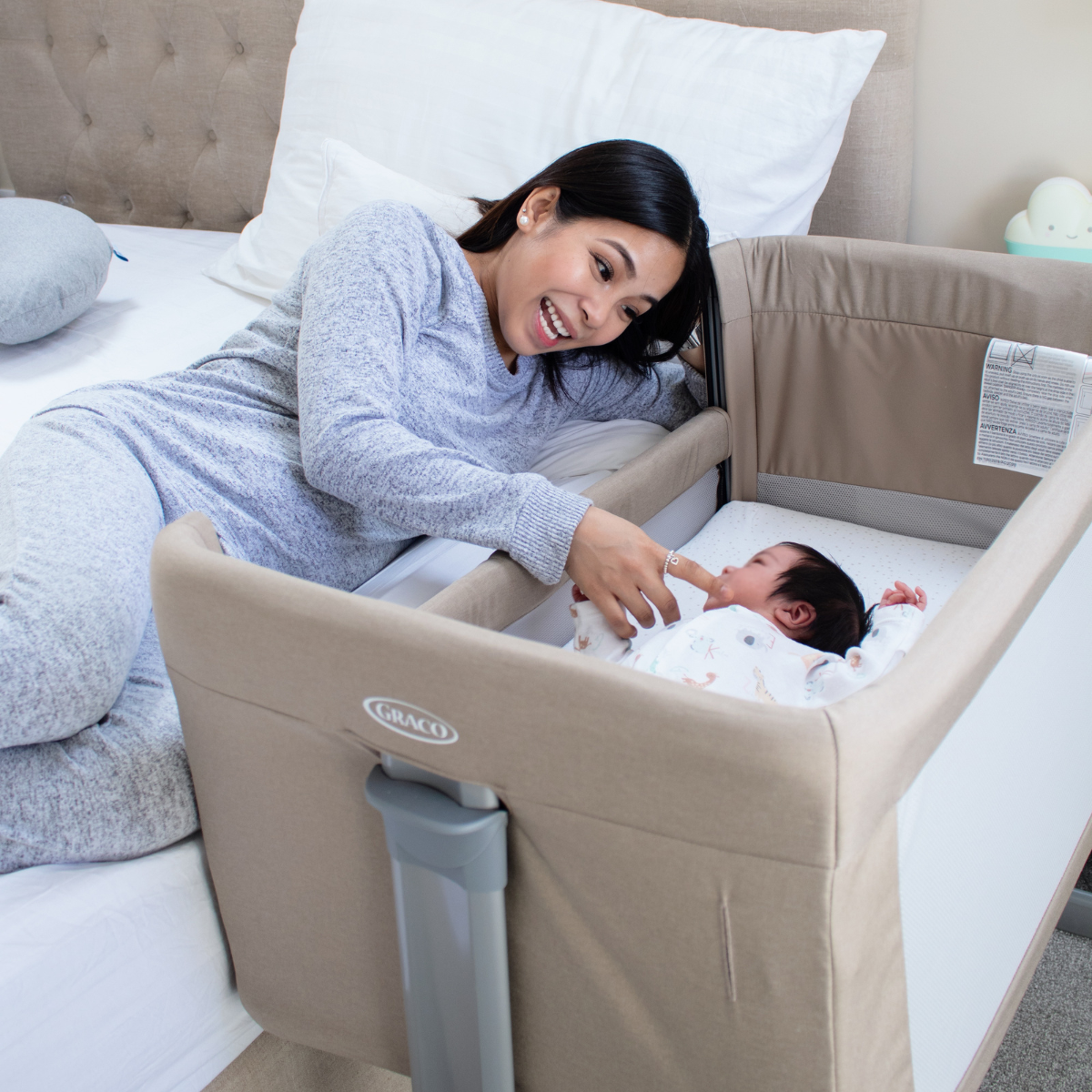 Baby sitting in kitchen in Graco Swift Fold highchair